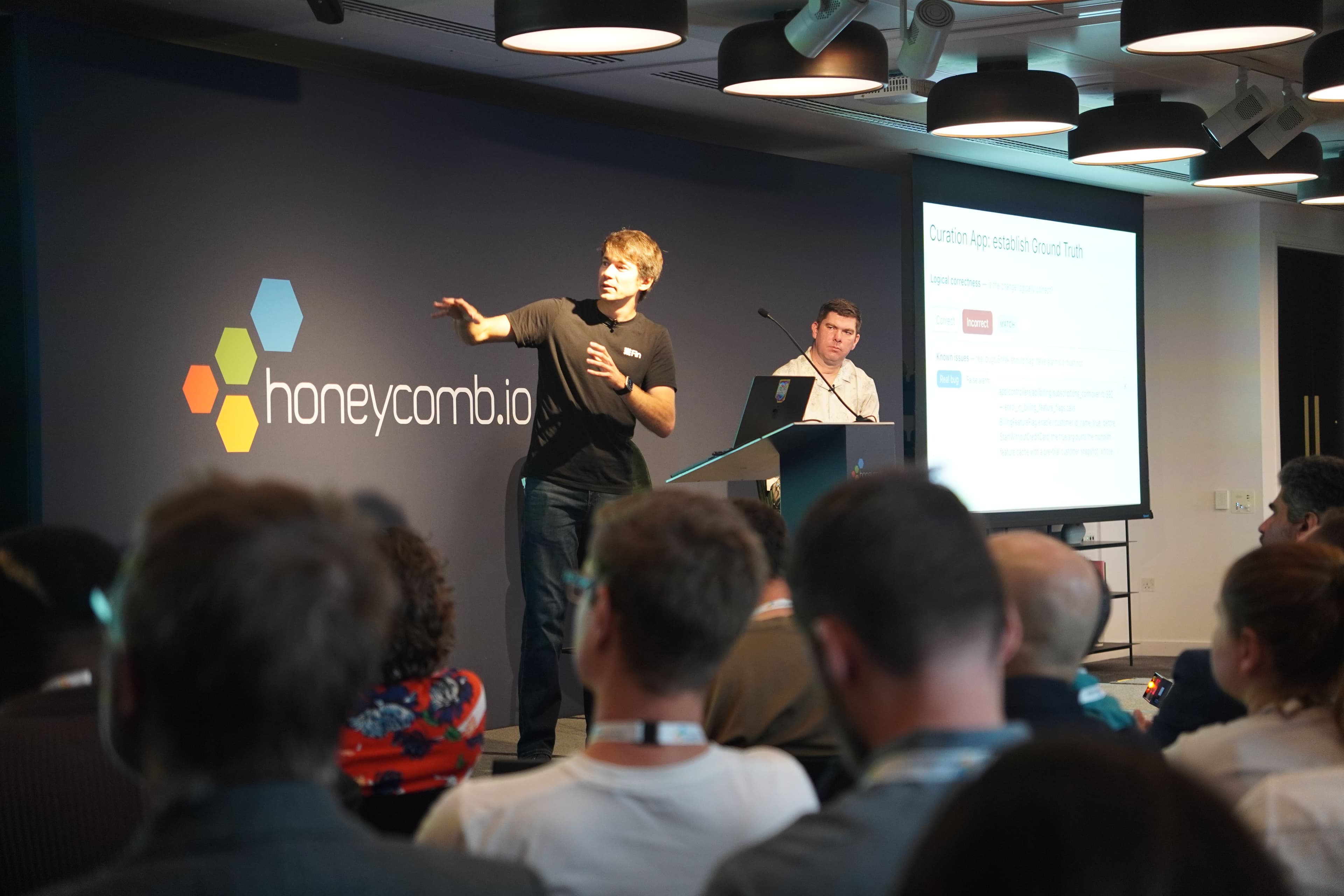 Brian and Kesha presenting Fin's PR review agent at O11yDay London 2026