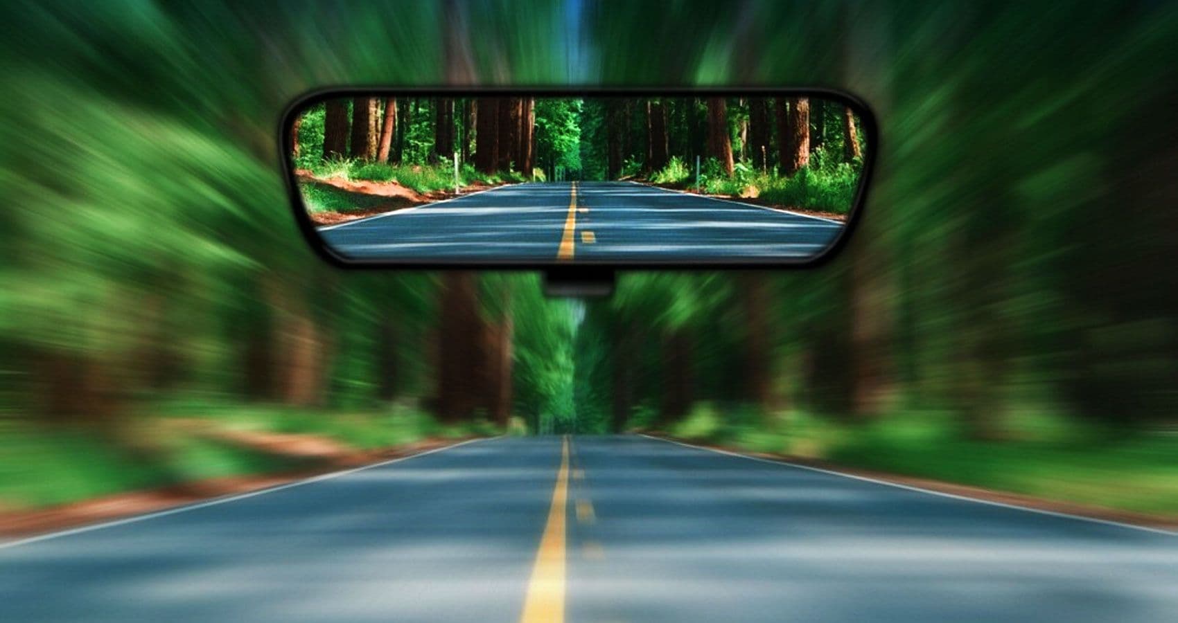 looking back through the rear-view mirror